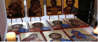 icons of saints laid out on table